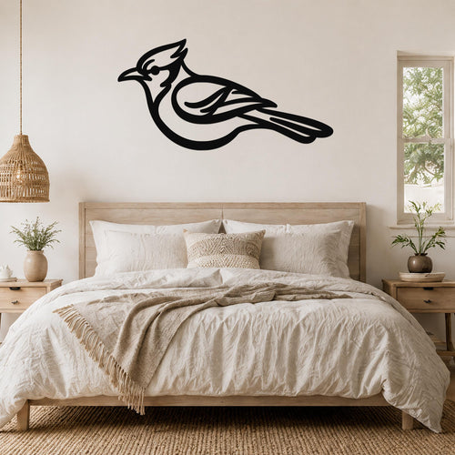 Black metal blue jay wall art silhouette mounted above a bed in a neutral bedroom.