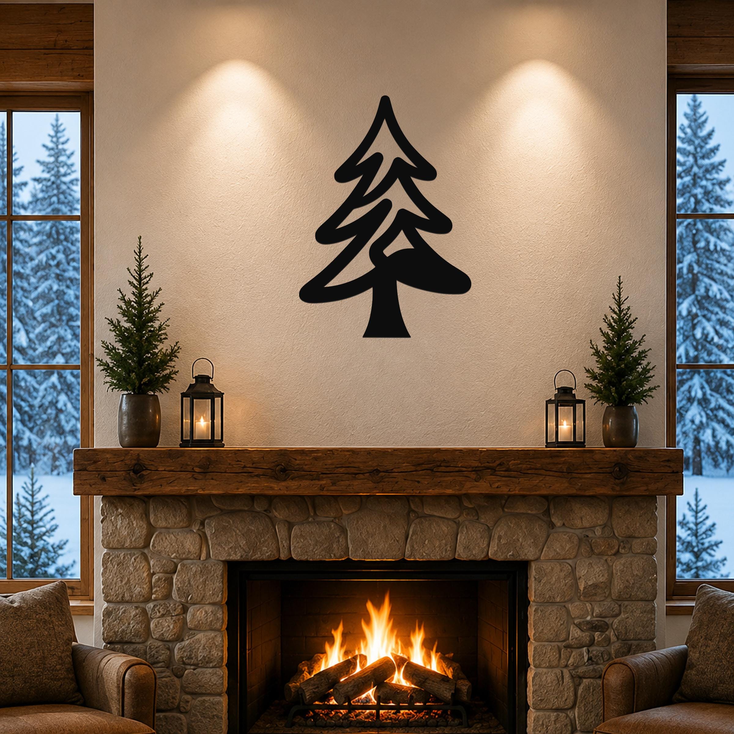 Black metal pine tree wall art with layered branch cutouts, mounted above a stone fireplace in a rustic living room.