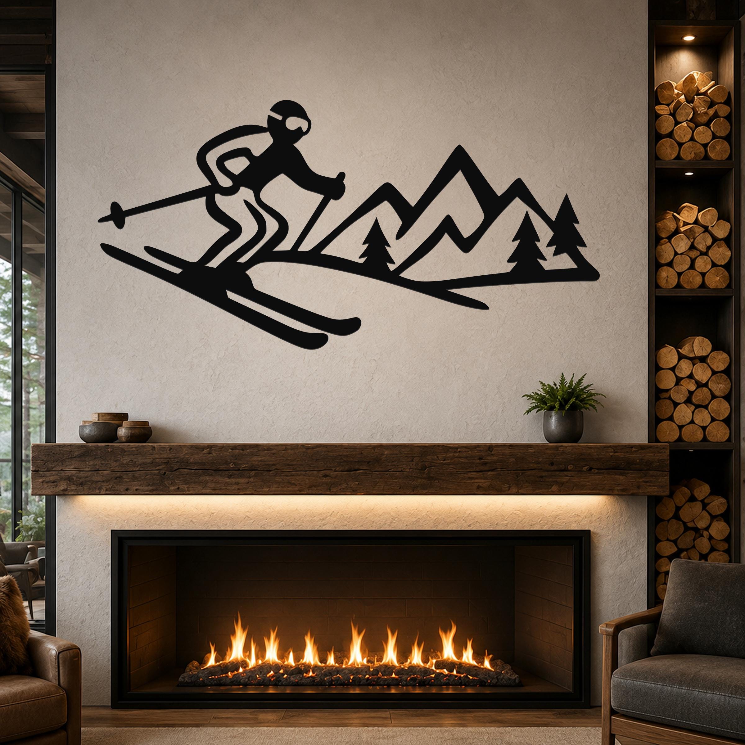 Black metal wall art featuring a skier silhouette and mountain range with pine trees, mounted above a fireplace in a living room.