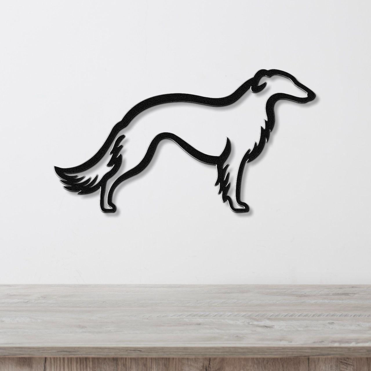 Black metal Borzoi dog wall art silhouette with detailed tail and leg cutouts, mounted on a white wall above a light wood counter.