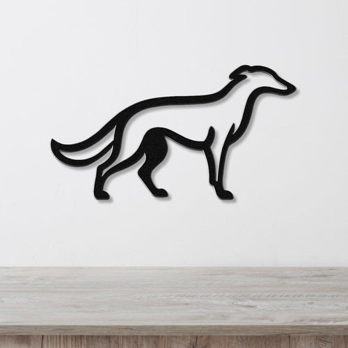 Black metal Borzoi dog wall art silhouette with cutout details, mounted on a white wall above a light wood surface.