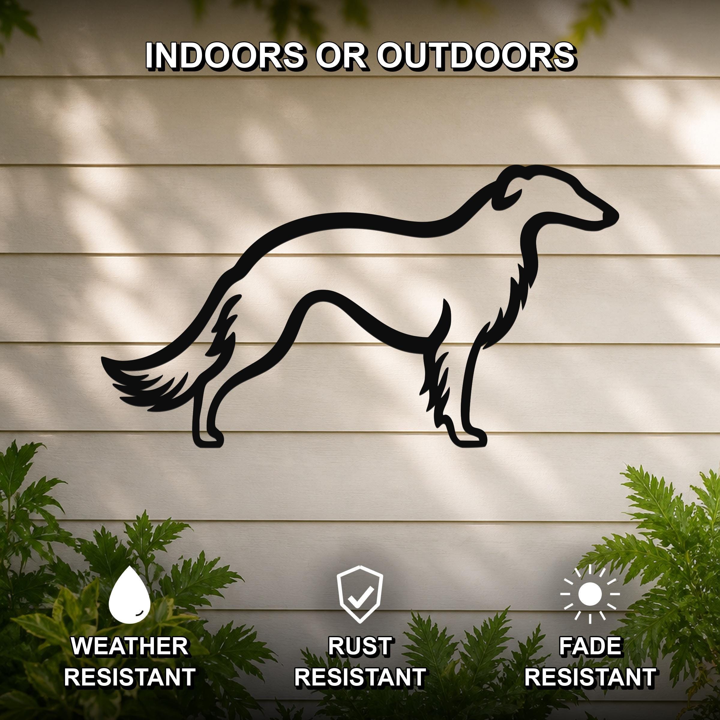 Black metal Borzoi dog silhouette wall art mounted on a light-colored outdoor wall, with green plants at the base and text indicating it is weather, rust, and fade resistant.