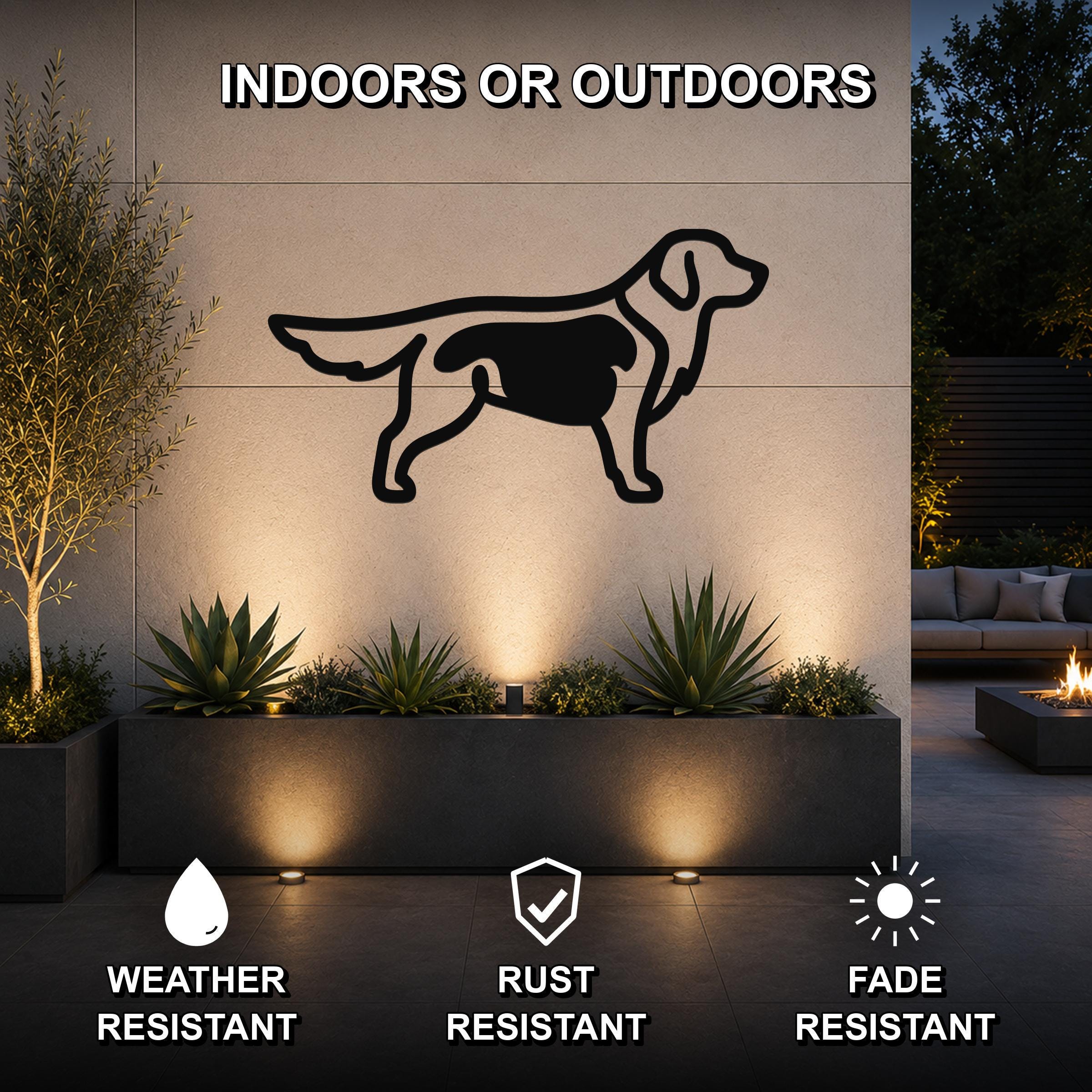 Black metal Golden Retriever wall art silhouette mounted on an outdoor wall above a planter, with text indicating it is weather, rust, and fade resistant.