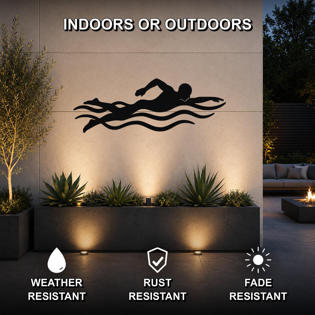 Black metal swimmer wall art with motion-line cutouts, mounted on an outdoor wall above a planter in a patio setting.
