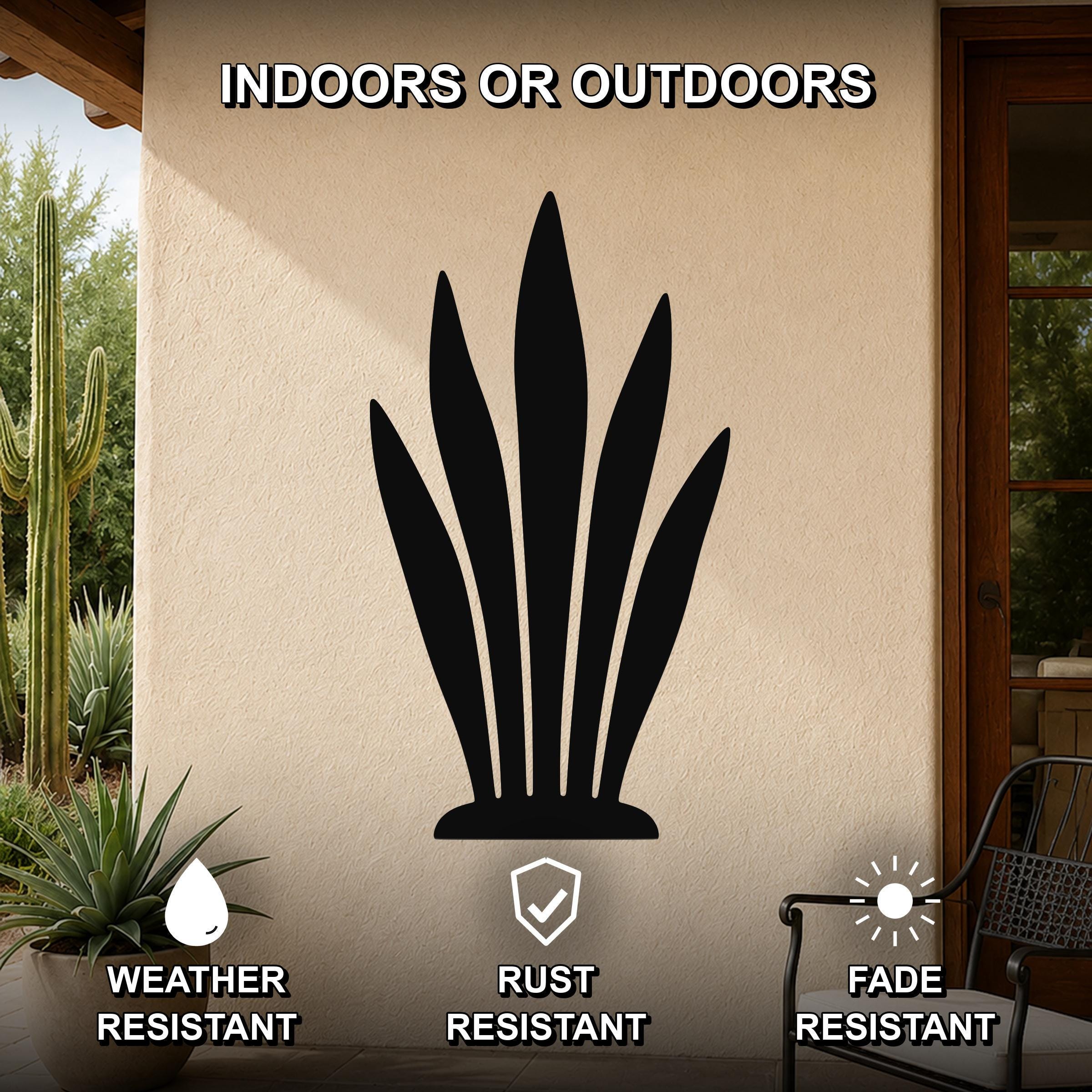 Black metal snake plant wall art silhouette mounted on an outdoor patio wall, weather resistant, rust resistant, and fade resistant.