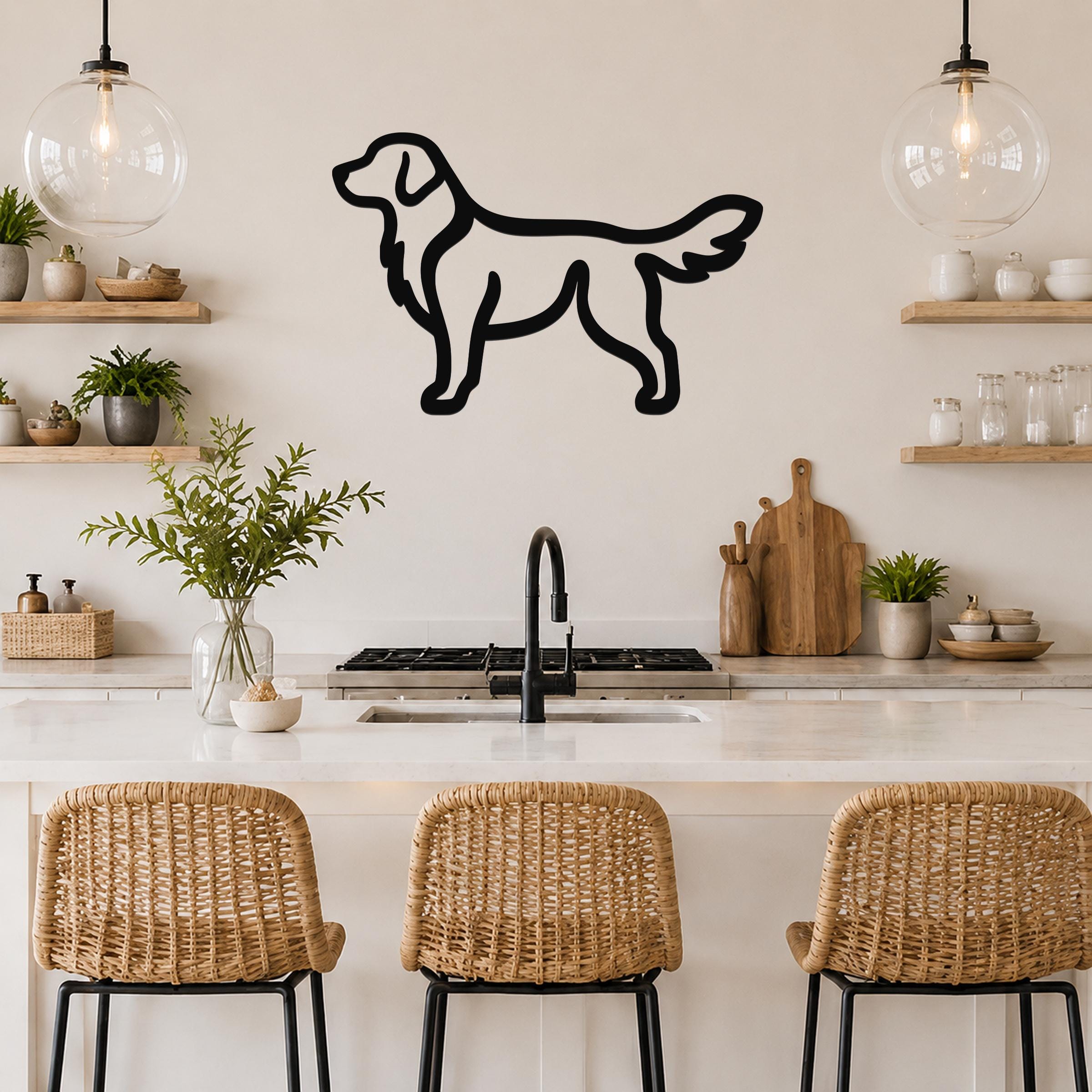 Black metal dog silhouette wall art, a golden retriever outline, mounted on a kitchen wall above a counter with wicker bar stools.