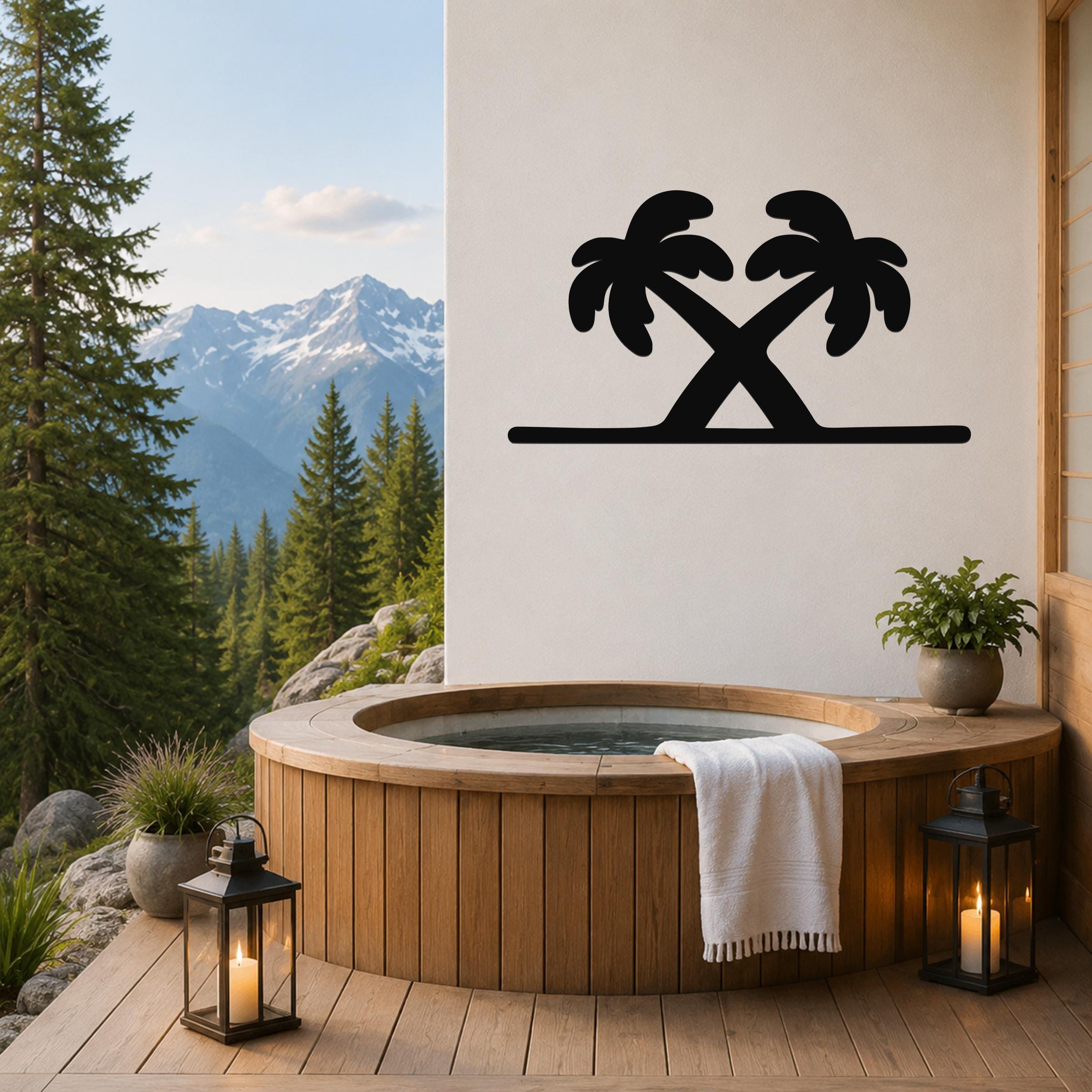 Black metal palm tree wall art with two crossed silhouettes, mounted on a white wall above a wooden hot tub on a deck with mountain views.