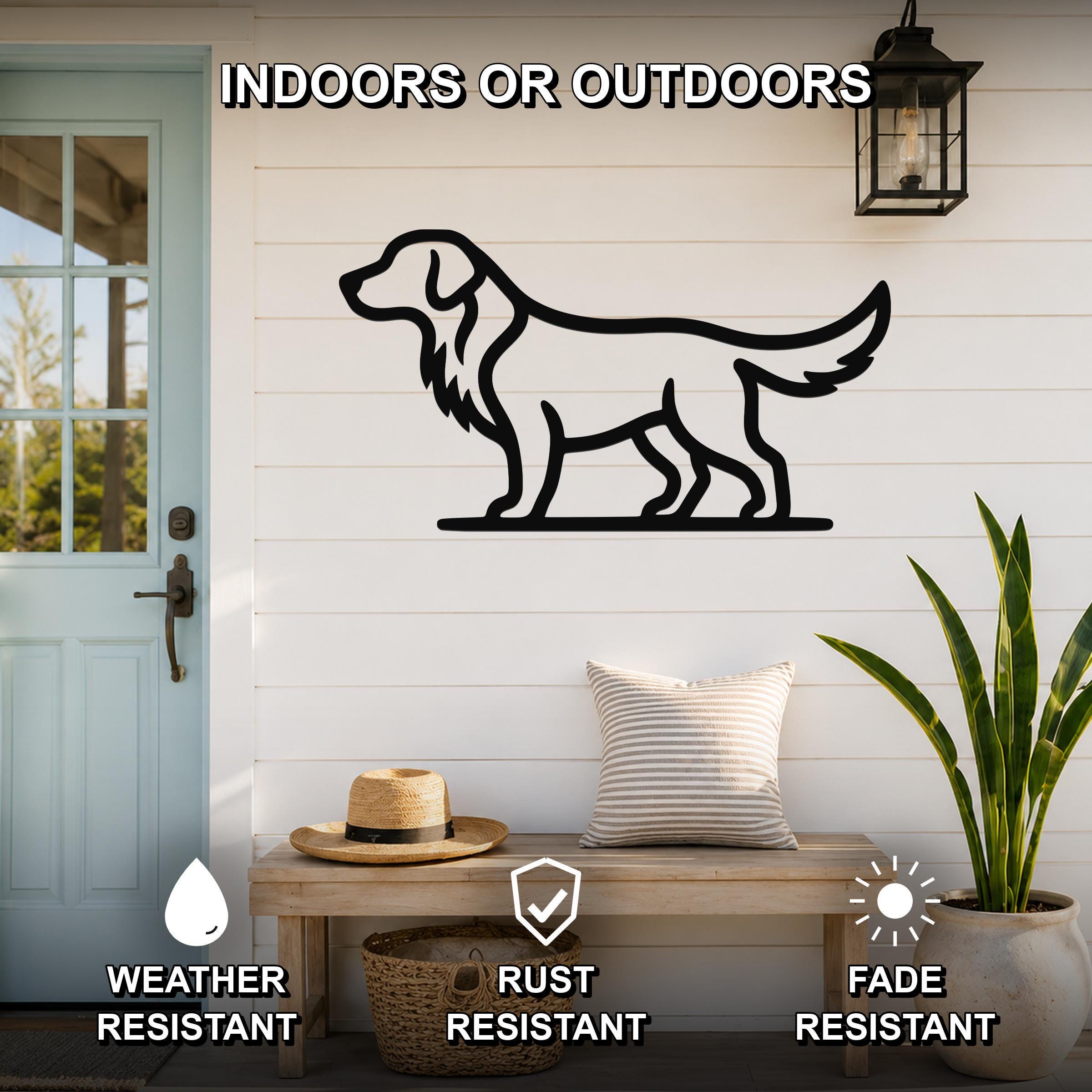 Black metal retriever silhouette wall art mounted on a white shiplap wall above a wooden bench in a porch setting.