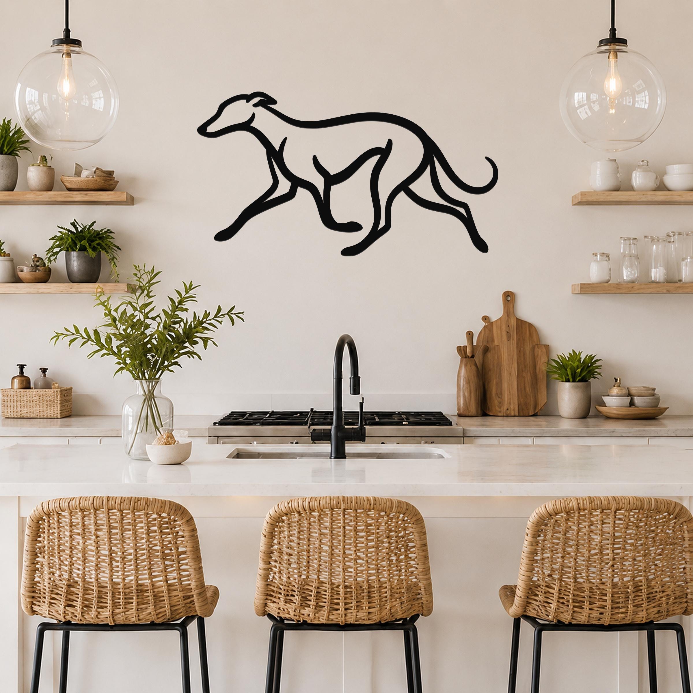 Black metal greyhound wall art with a minimalist silhouette design, mounted on a kitchen wall above a counter.