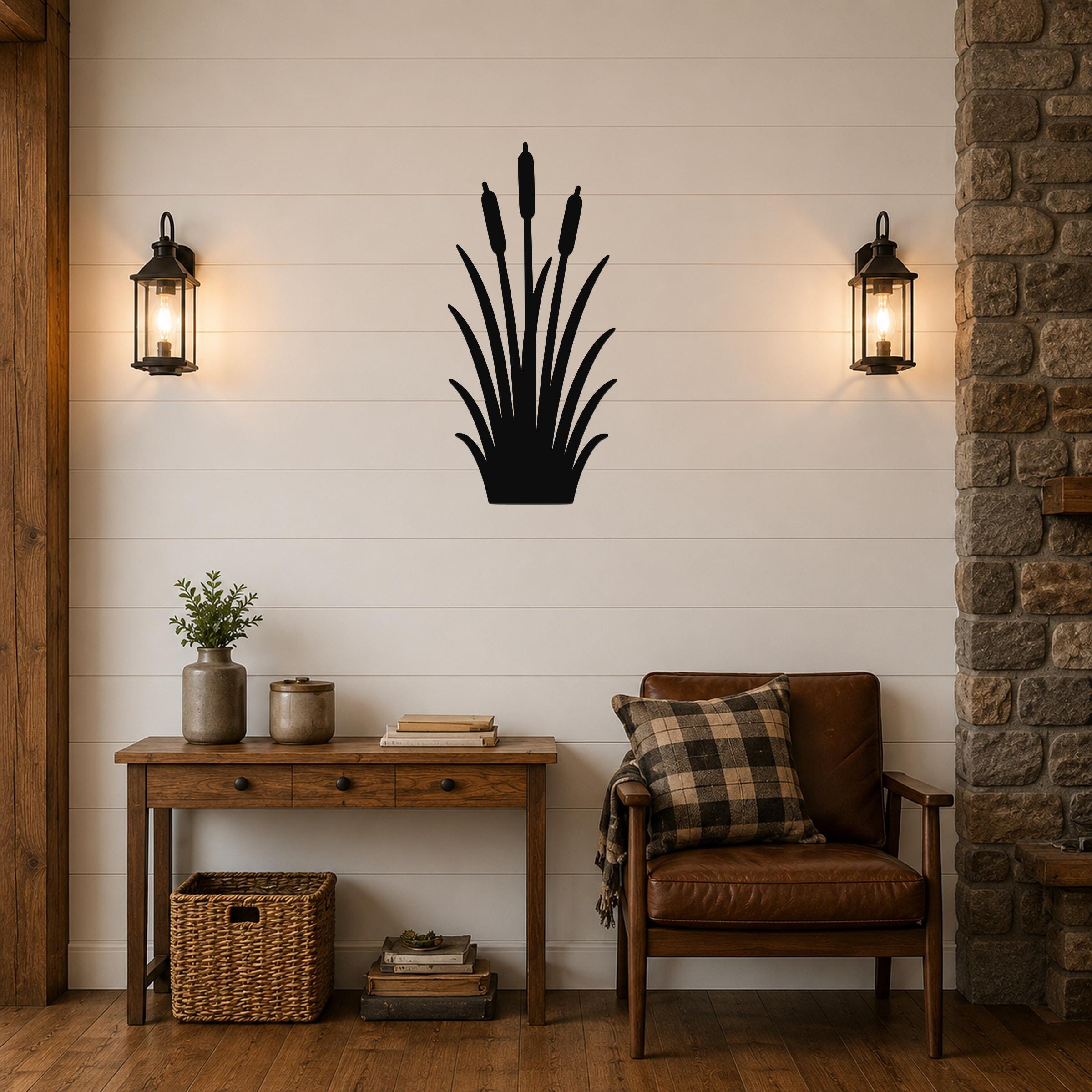 Black metal cattail wall art silhouette mounted on a shiplap wall above a wooden console table in a living room.