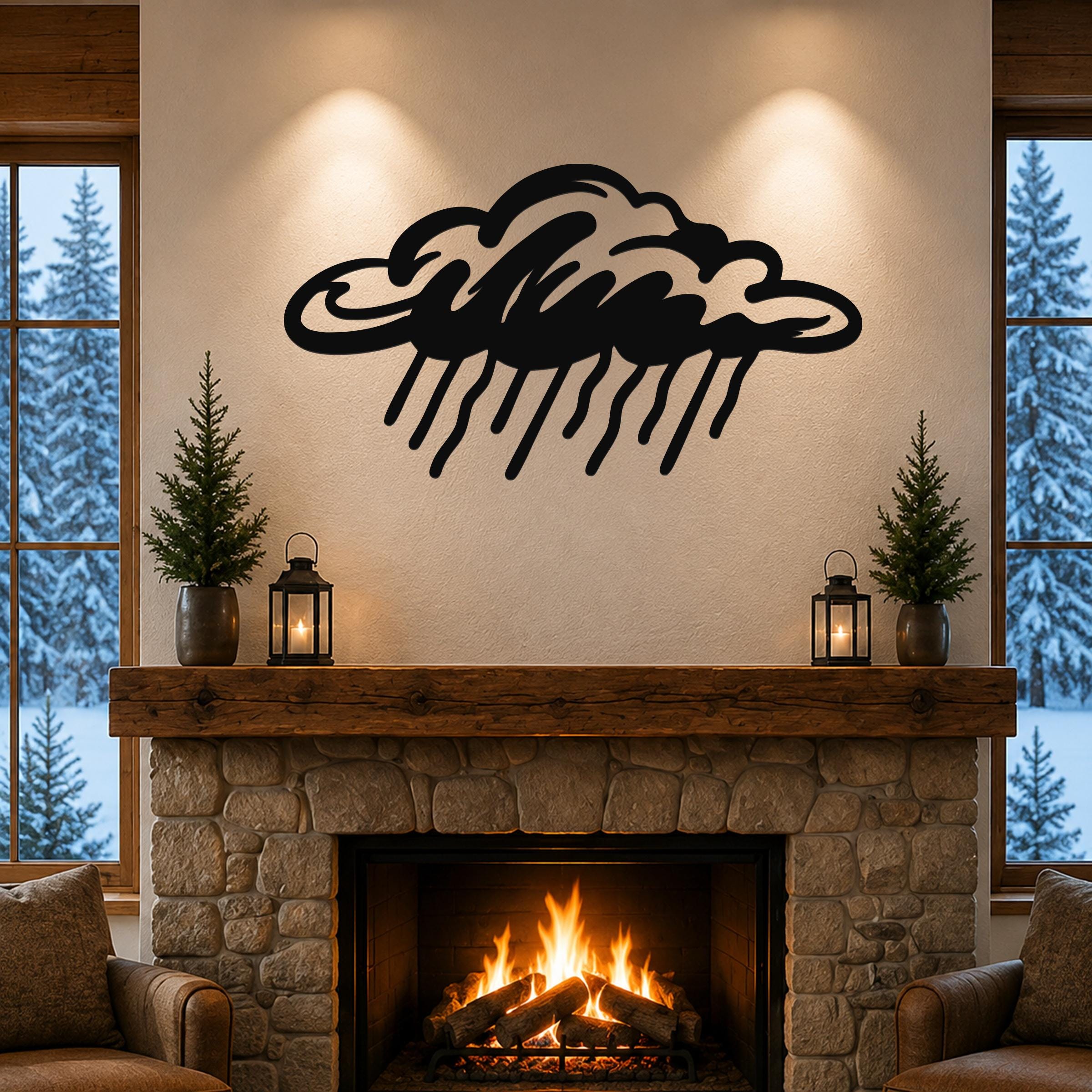 Black metal rain cloud wall art with raindrop cutouts, mounted above a stone fireplace in a cozy living room.