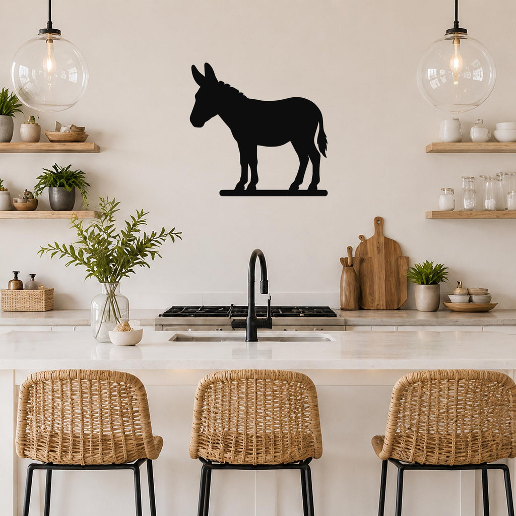 Black metal donkey silhouette wall art mounted on a kitchen wall above a counter, with wicker bar stools and open shelving visible below.