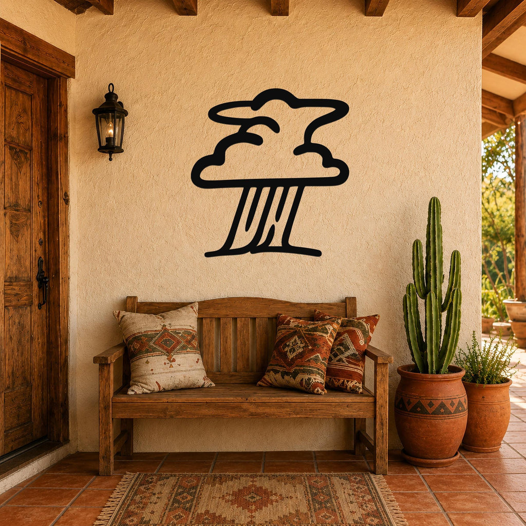 Black metal wall art in a storm cloud silhouette with rain lines, mounted on a stucco wall above a wooden bench in a patio entryway.