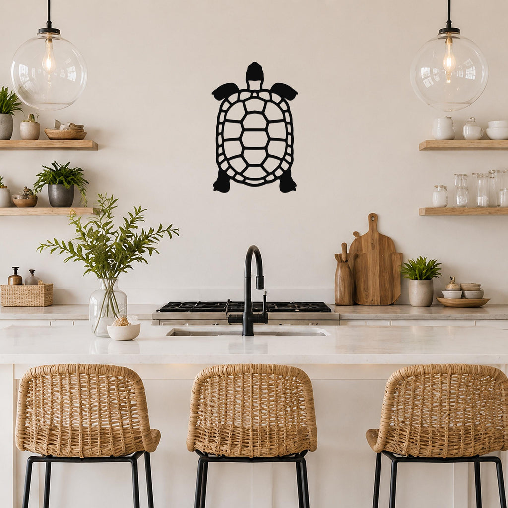 Black metal tortoise wall art with a cutout shell design, mounted on a kitchen wall above a counter.